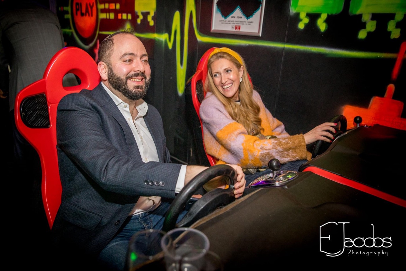 Parents racing on the arcade driving game